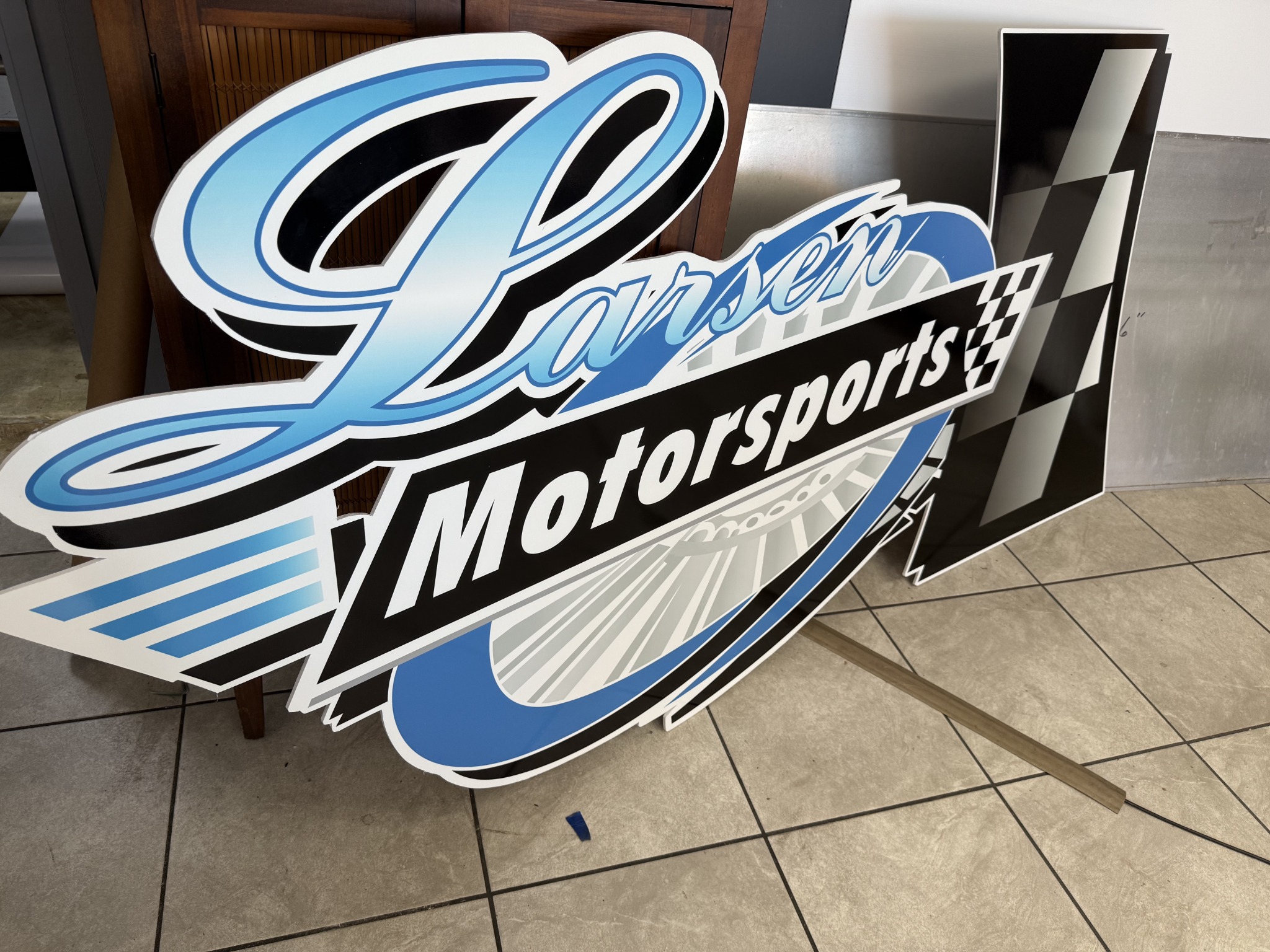 Custom dimensional motorsports sign produced by Wrap Giants