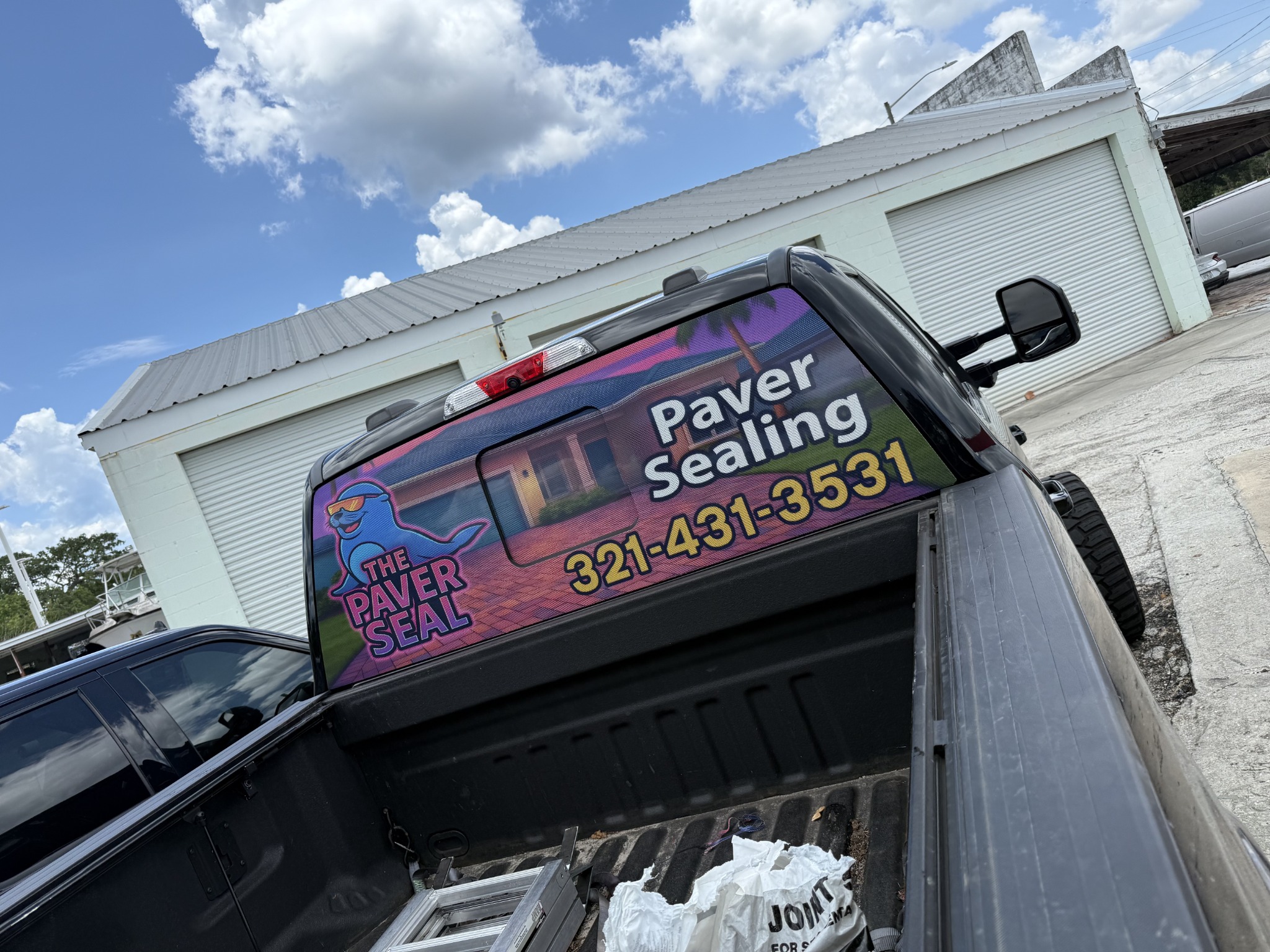 Paver sealing tailgate graphics