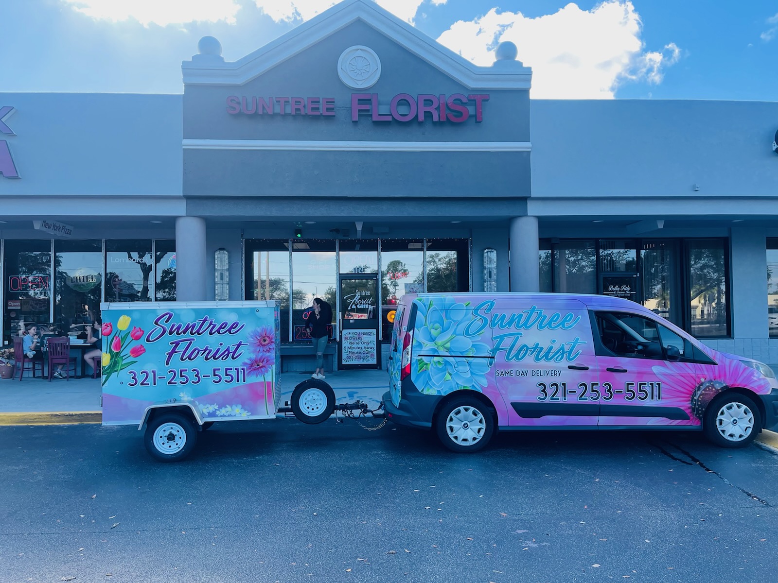 Coordinated commercial fleet van graphics by Wrap Giants