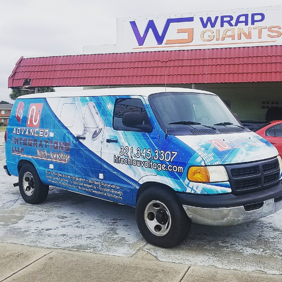 Custom blue commercial van graphics by Wrap Giants