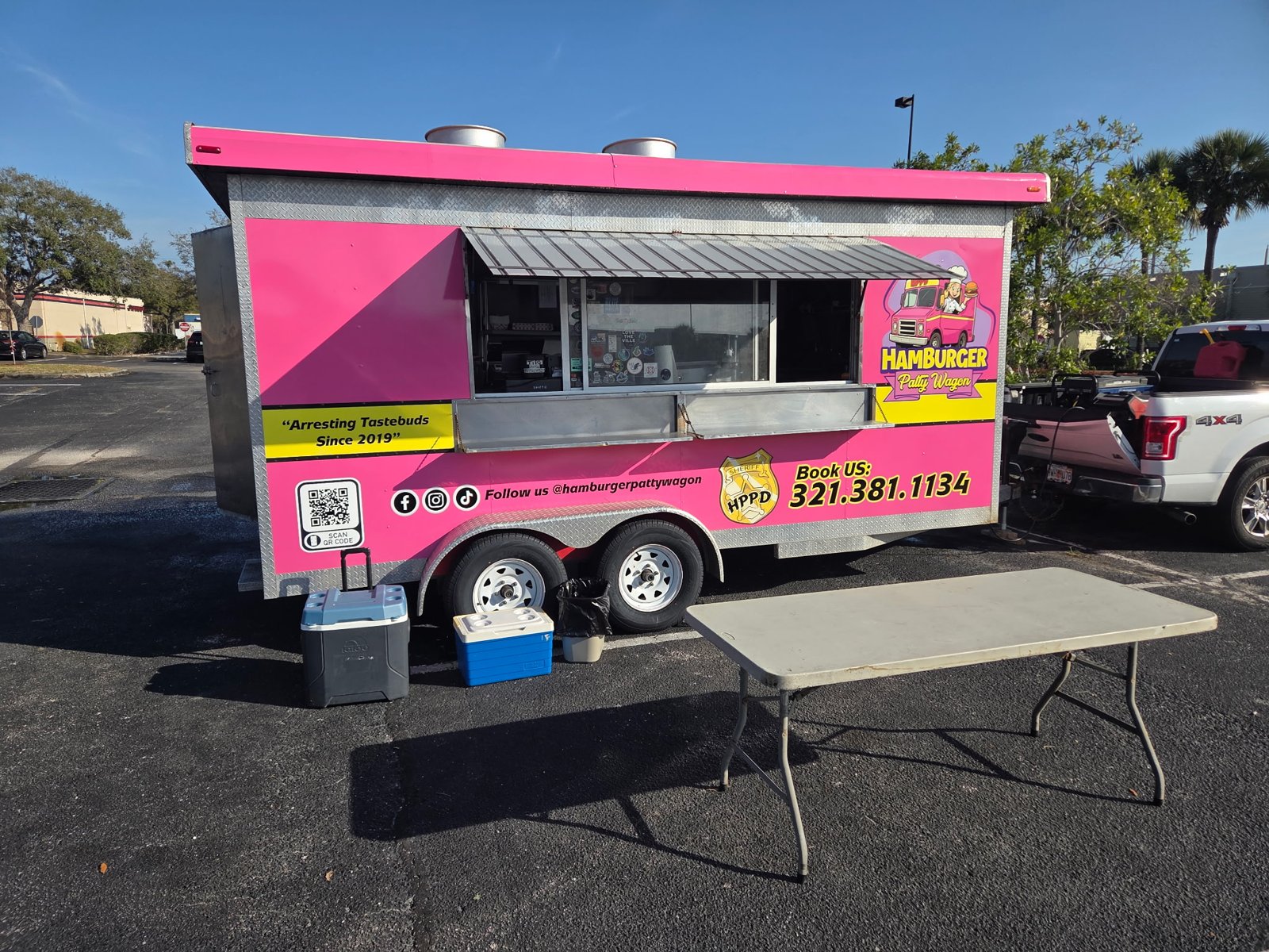 Custom pink food-trailer graphics